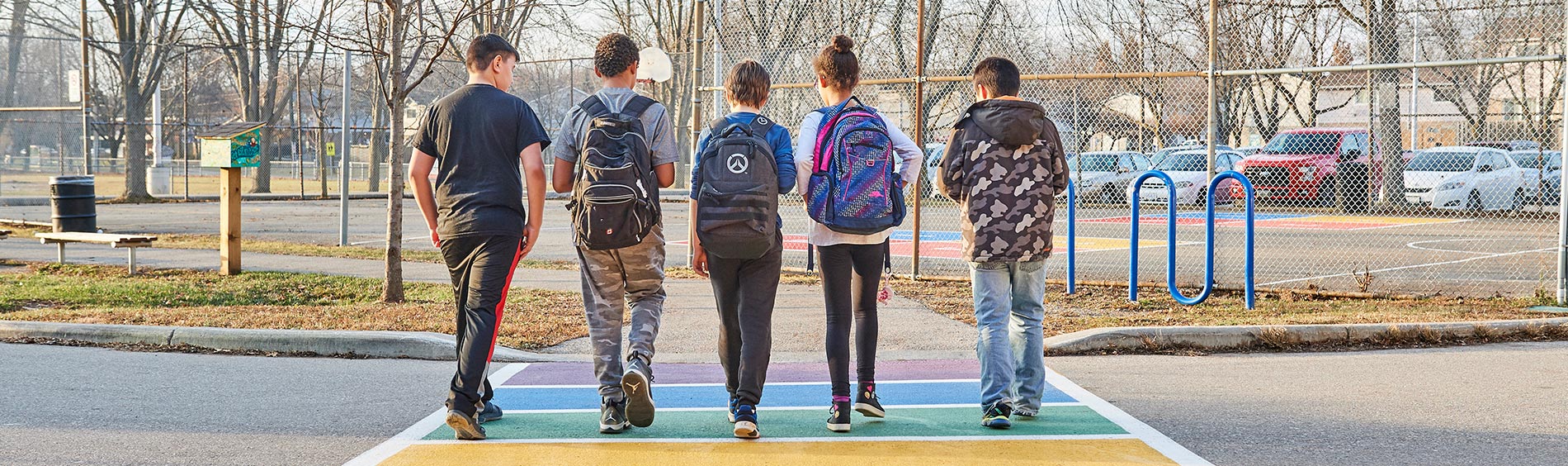 teens walking together with backpacks