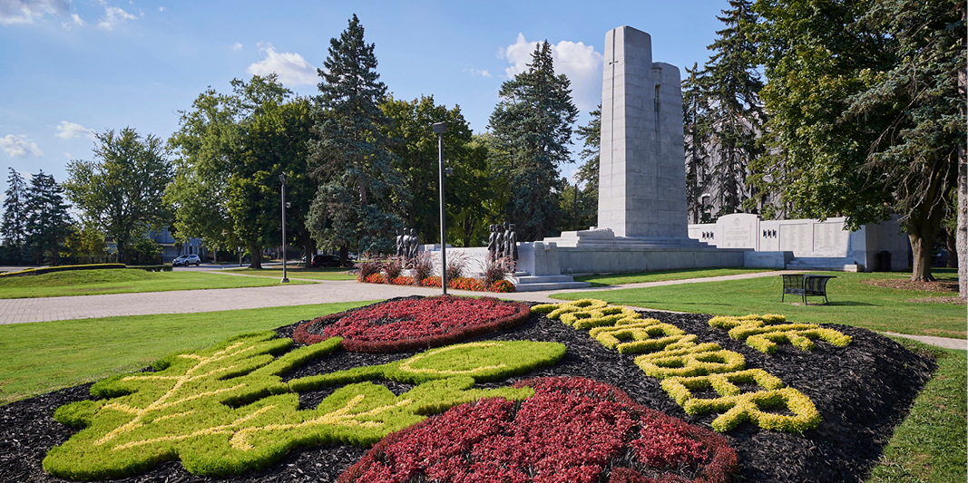 City of Brantford Cenotaph with flower arrangement that reads "We Remember"