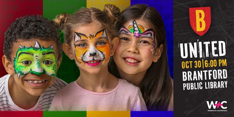 Group of young children smiling with their faces painted