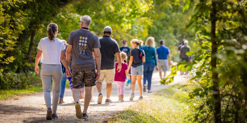 A group of people walking along the SC Johnson Trail during the Culture Days on the Trails event